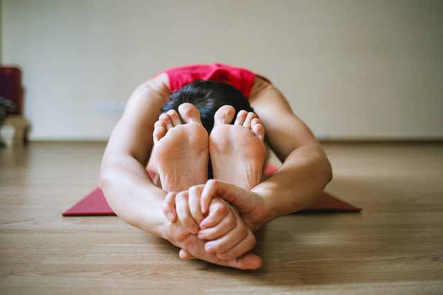 Individual performing gentle stretches as part of a rehabilitation routine in the Western Downs.